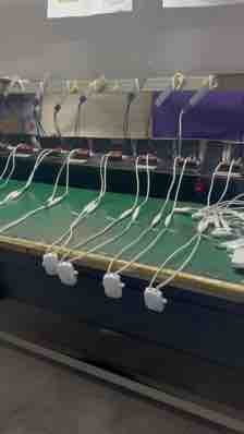 Rows of connected round light units on a factory bench