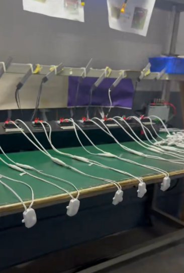 Connected round sensor units and wiring on a factory inspection bench